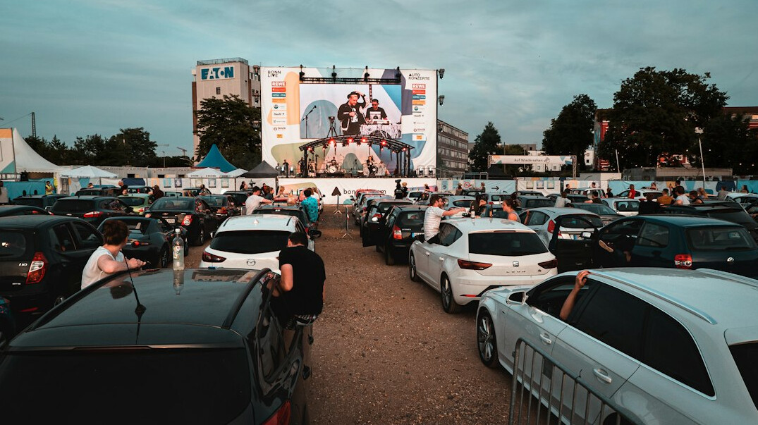 Outdoor film festival screening at dusk near Lake Geneva in Montreux